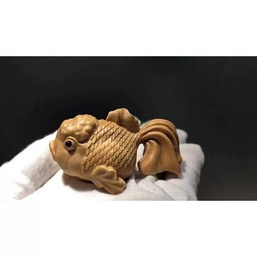 木雕金魚圖片大全大圖：“木雕金魚”傳統(tǒng)手工藝品的藝術魅力與視覺呈現(xiàn)