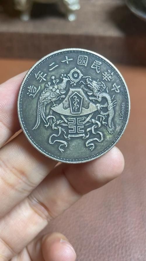 龍鳳一元真品圖片【民國十二年龍鳳壹圓銀幣及龍鳳銀幣鑒定方法百度經驗】