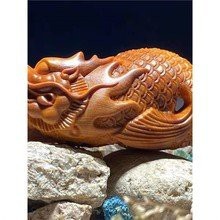 龍魚木雕的價格范圍是多少？【如何辨別龍魚木雕的真?zhèn)危俊? title=