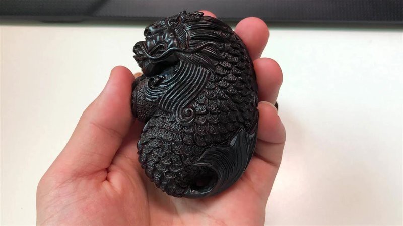 給我一些龍魚雕刻的圖片欣賞
