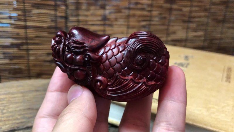 龍魚手把件的寓意和象征