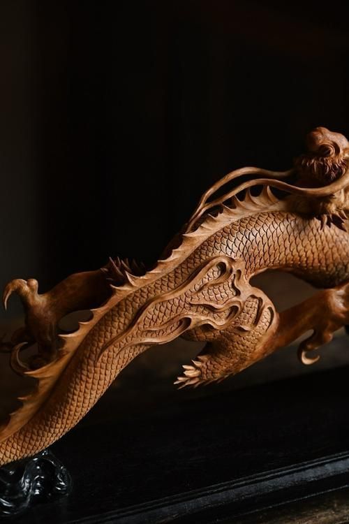 給我一些木雕龍頭的圖片素材，如何找到更多木雕龍頭圖片素材