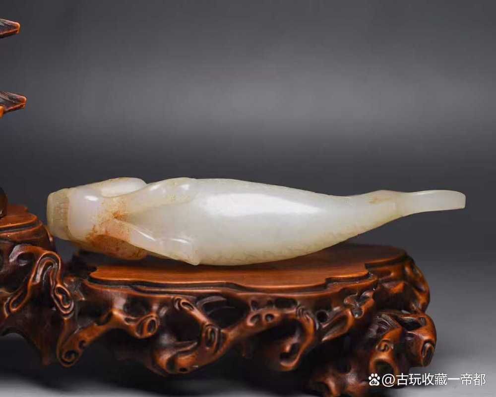 給我一些龍頭魚玉擺件的圖片，——龍頭魚玉擺件的真偽