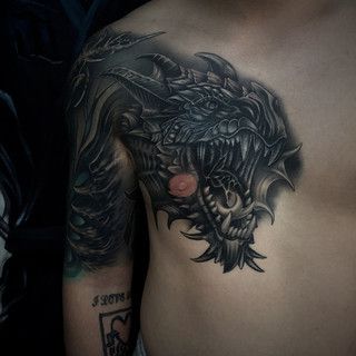 紋身龍頭魚身是什么寓意：紋身龍頭魚身的設(shè)計(jì)靈感來自于中國(guó)古代神話傳說中的神獸——螭吻